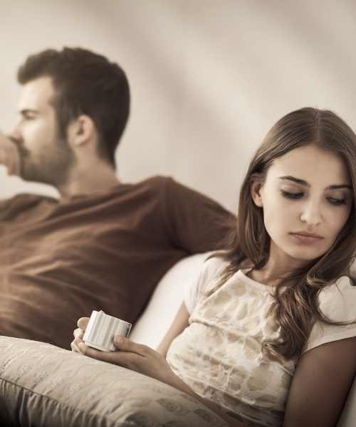 Couple sitting apart during a difficult conversation