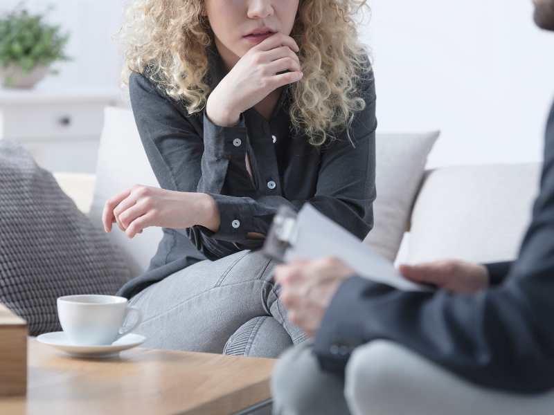 Client speaking with a therapist during a counselling session